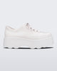 Side view of Melissa Kick Off platform sneaker in white. The sneaker has traditional white tie up laces.