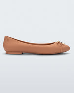 Side view of a dark beige Melissa flat with a beige bow detail with gold accents on the toe