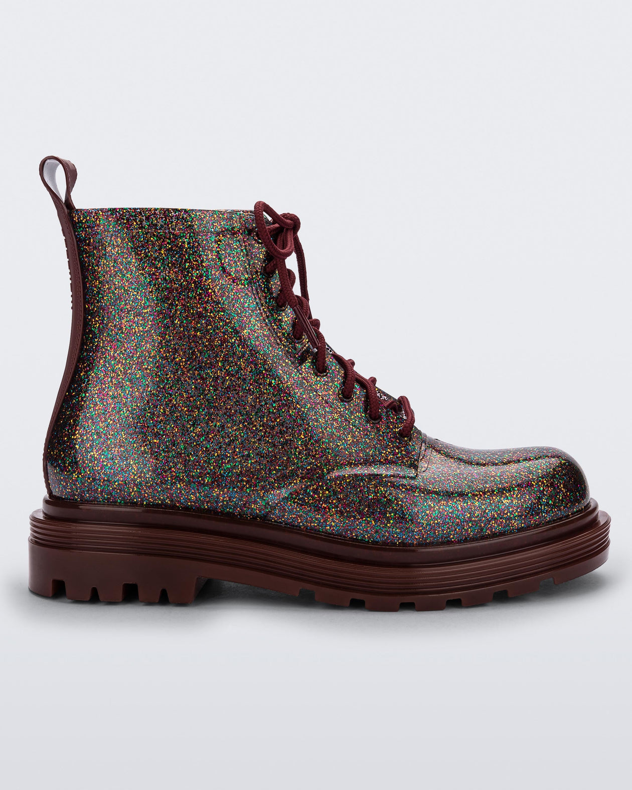 Side view of a black/multicolor glitter Melissa Coturno boot.