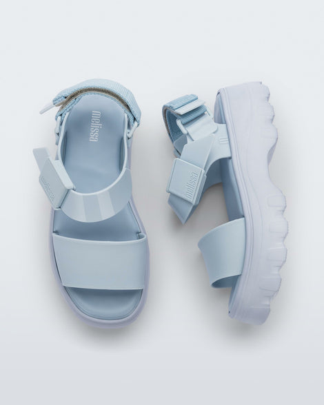 A top and side view of a pair of light blue Melissa Kick Off platform sandals with a front and ankle strap