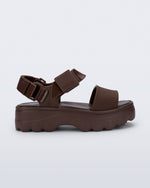 Side view of a brown Kick Off Sandal