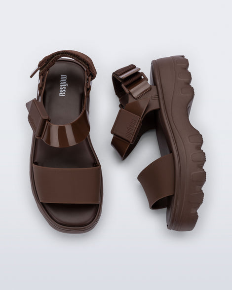 Top and side view of a pair of brown Kick Off Sandals