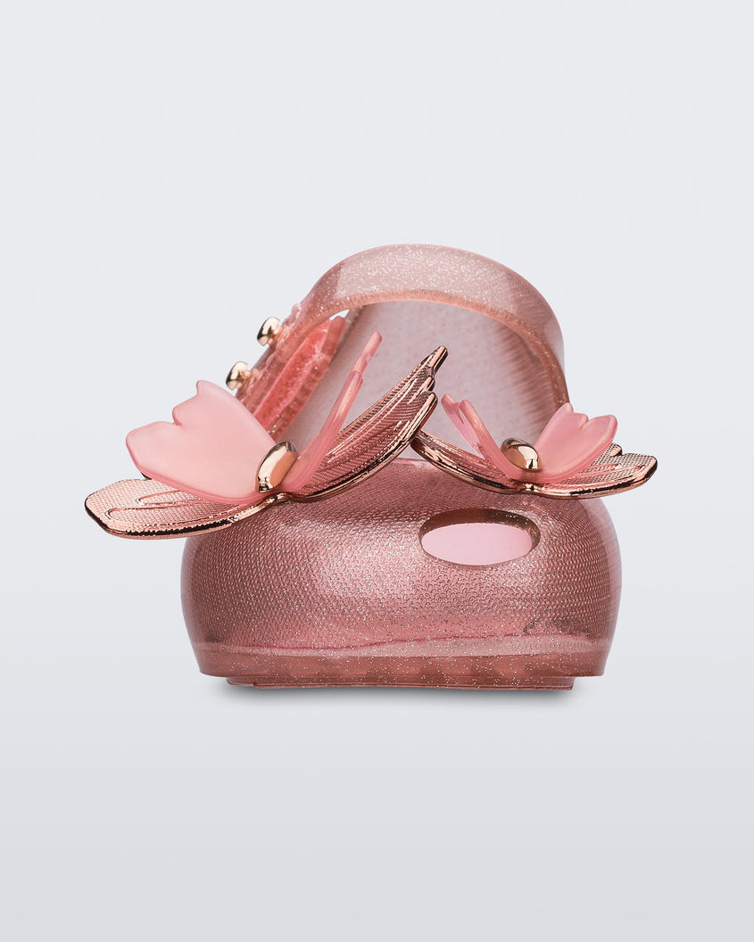 Front view of a glitter clear pink Mini Melissa Ultragirl Butterfly baby mary jane flat with two pink metallic and clear butterflies and peep toe.