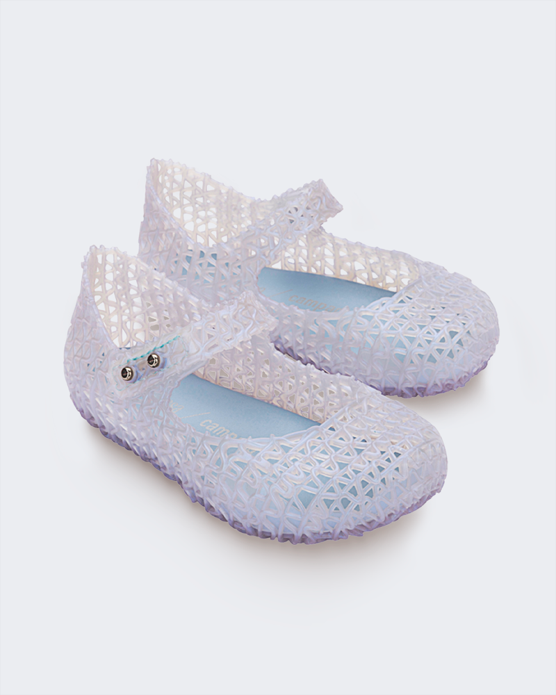 Angled view of a pair of Mini Melissa Campana ballet flats in clear