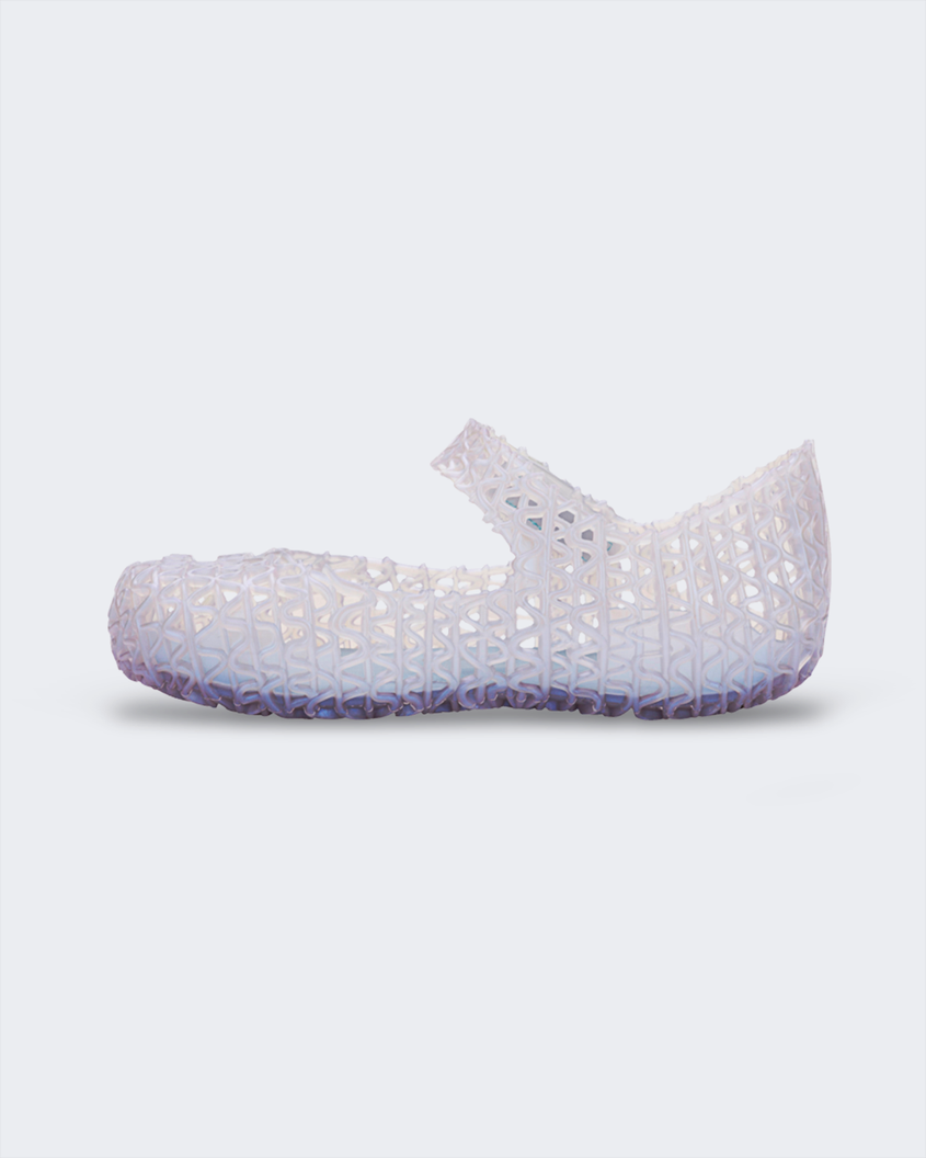 An inner side view of a pearly blue Mini Melissa Campana flat with a distinctive interwoven pattern
