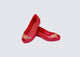 Angled view of a pair of red Ultragirl Stars kids ballerina flat with stars on the upper