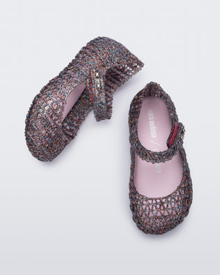 Top and side view of a pair of glitter clear/pink Campana baby flats