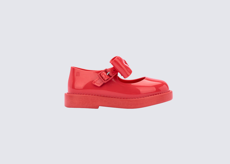 side view of a red Blair baby mary  jane with bow in the strap