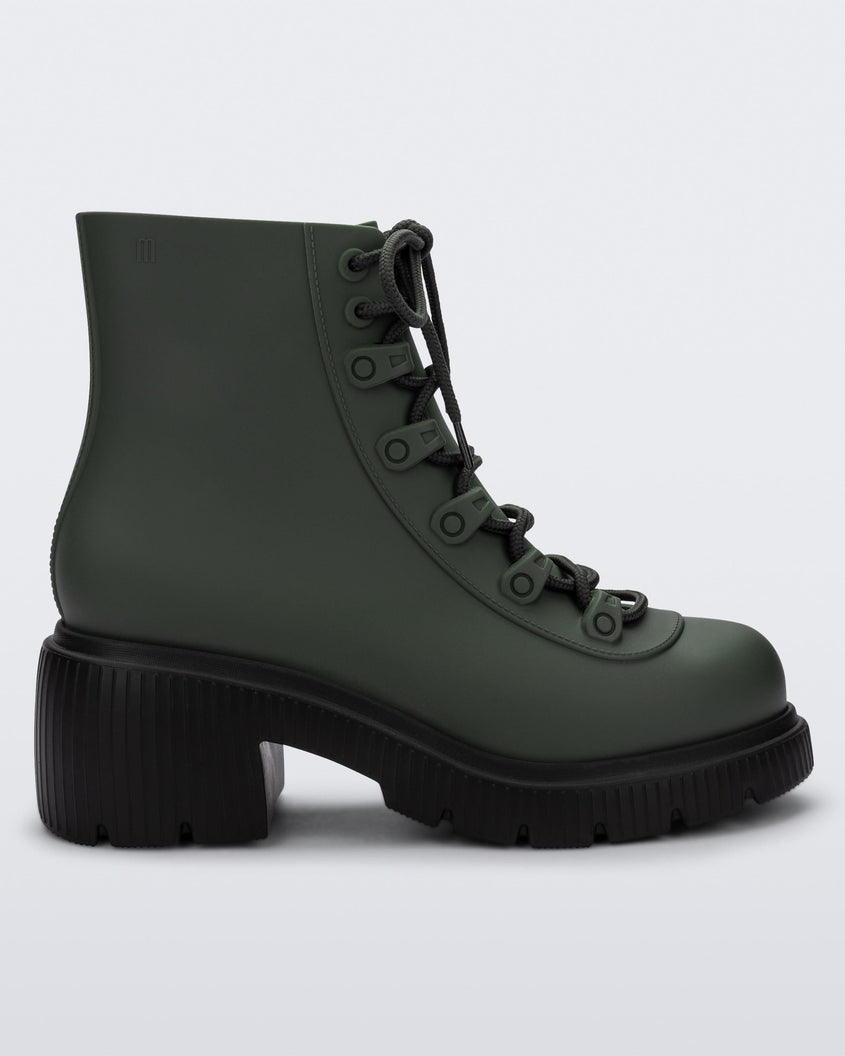 Side view of a green/black Melissa Cosmo boot.