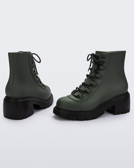 Side and back view of a pair of a green/black Melissa Cosmo boots.
