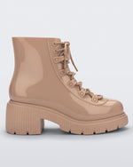 Side view of a beige Melissa Cosmo boot.