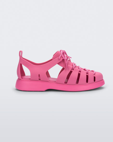 Side view of a pink Match sneaker sandals