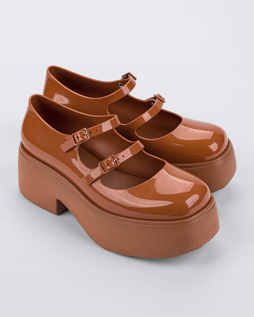 Top and side view of a pair of brown Melissa Farah Platforms.