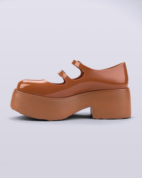 Angled view of a pair of brown Melissa Farah Platforms.