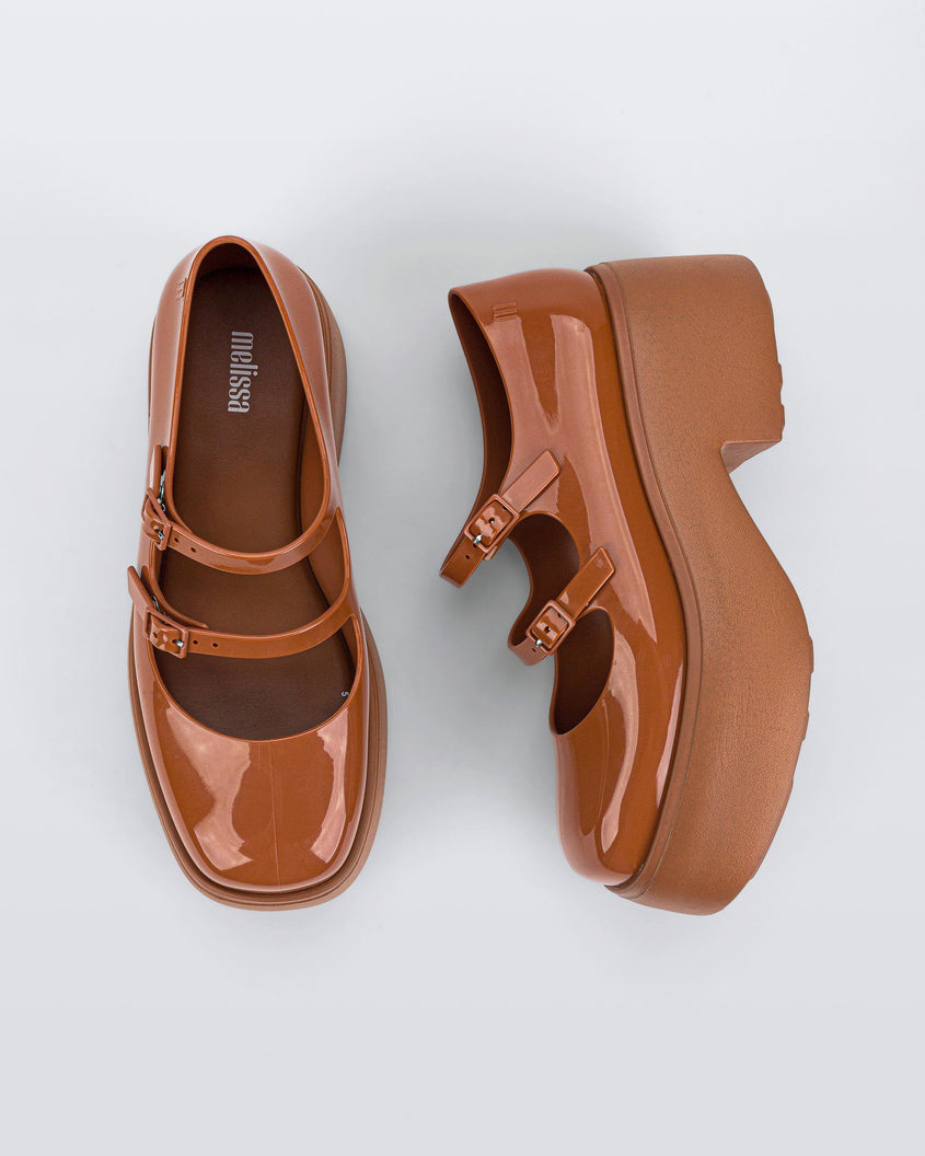 Top and side view of a pair of brown Melissa Farah Platforms.