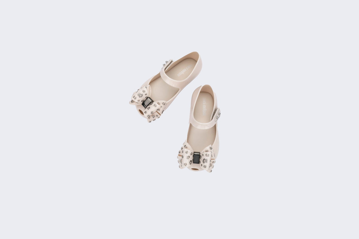 Top view of a pair of beige Ultragirl Sweet X baby flats