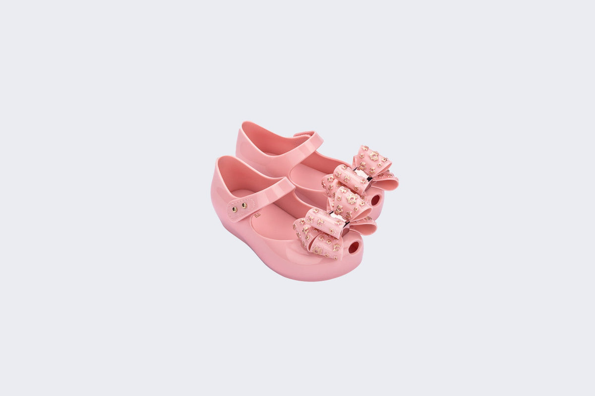 Angled view of a pair of pink Ultragirl Sweet X baby flats