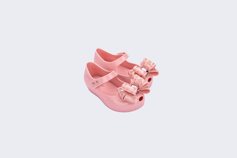 Angled view of a pair of pink Ultragirl Sweet X baby flats