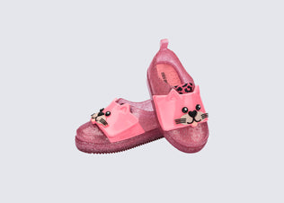Angled view of a pair of pink Jelly Pop Safari baby sneakers