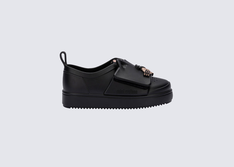 Side view of an black Jelly Pop Safari baby sneaker