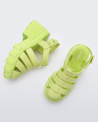 Top and side view of a pair of yellow Melissa Megan platform heel sandal.