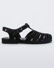 Side view of a black flocked Melissa Possession Velvet sandal.
