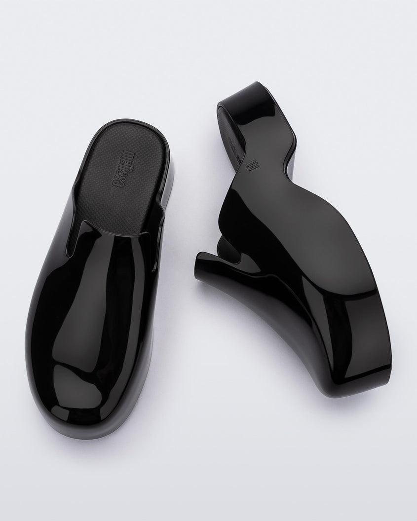 Top and side view of a pair of black Melissa Zoe mules.