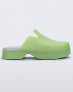 Side view of a green Melissa Zoe mule with purple insole.