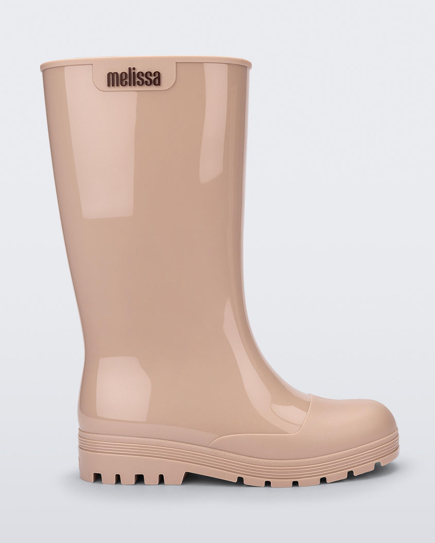 Side view of a beige Melissa Welly boot.