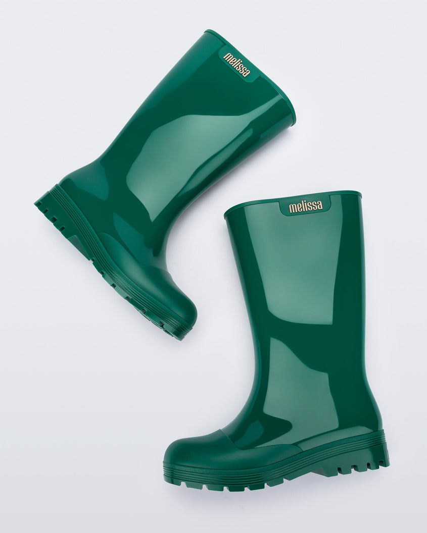 Side view of a pair of green Melissa Welly boots.