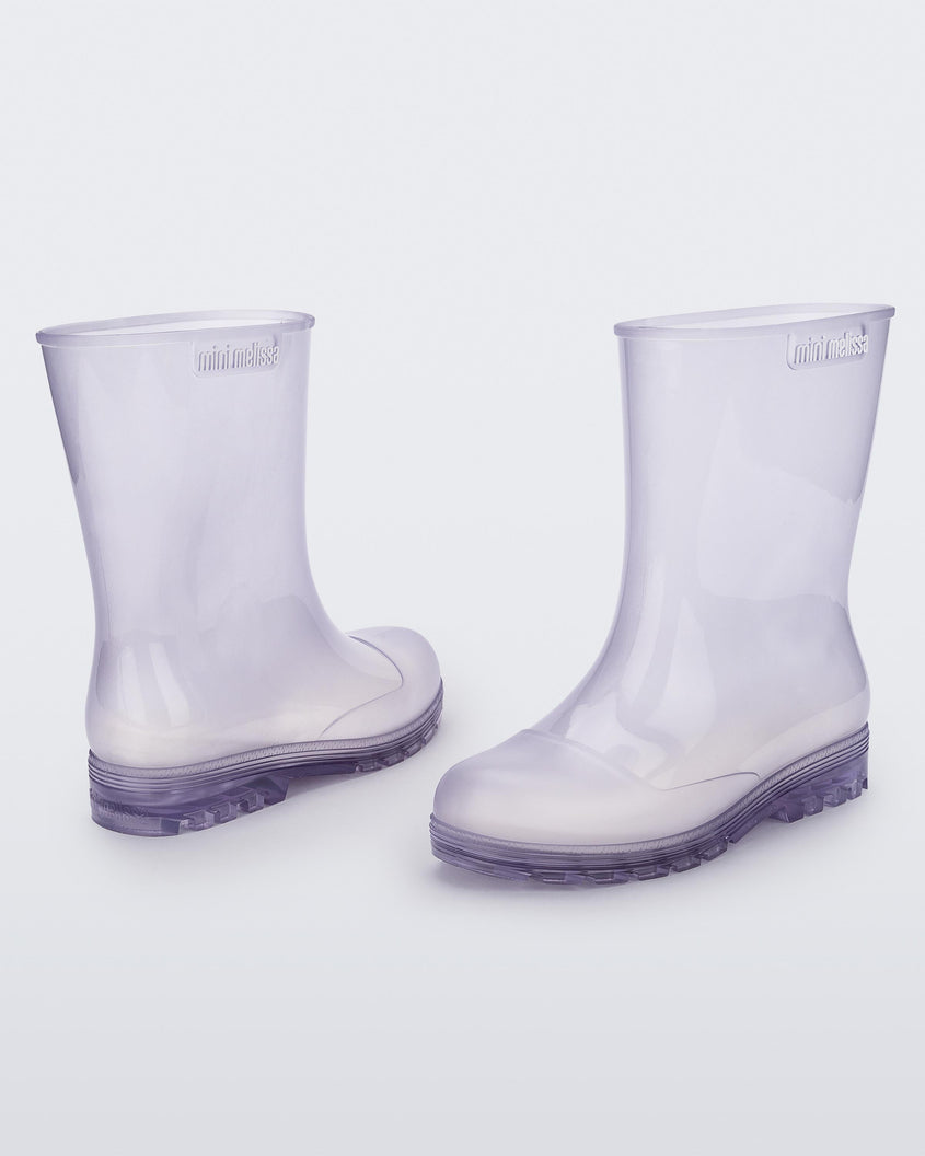 Angled view of a pair of clear kids Melissa Welly boots.