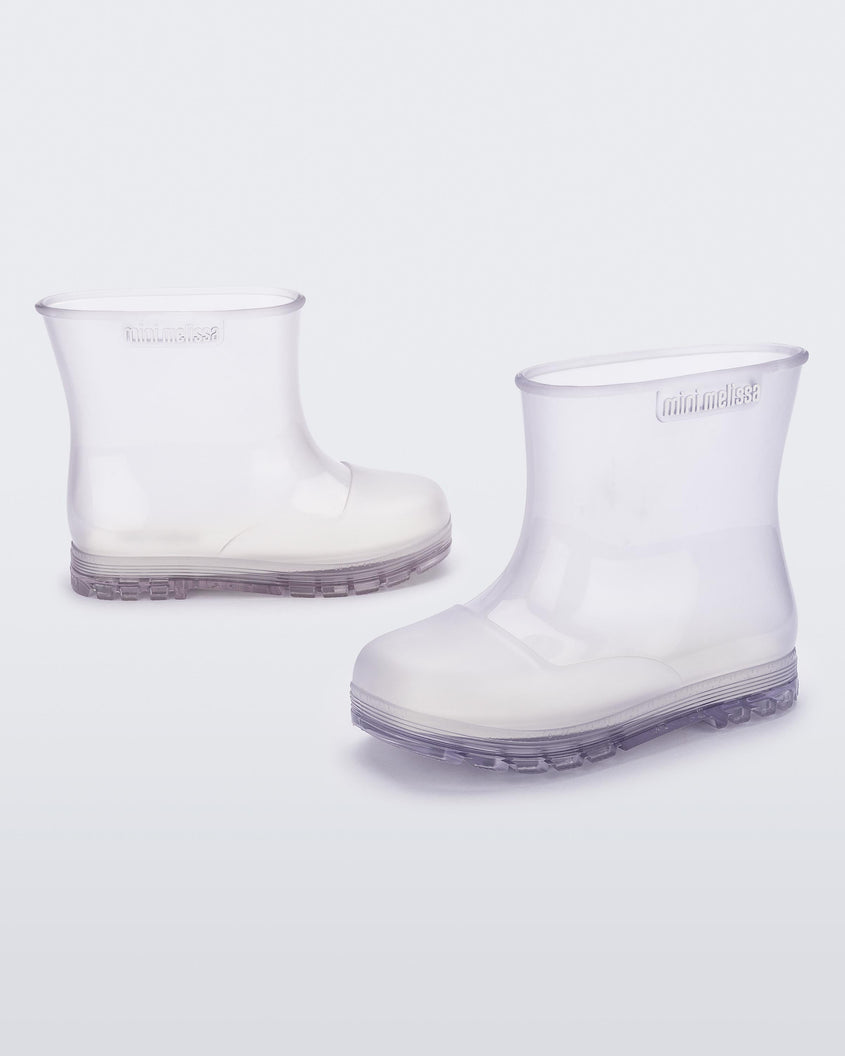 Angled view of a pair of clear baby Melissa Welly boots.