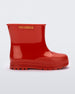 Side view of a red baby Melissa Welly boot.