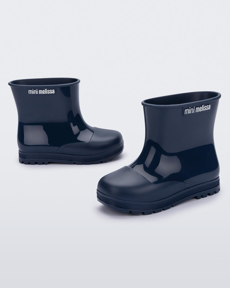 Angled view of a pair of blue baby Melissa Welly boots.