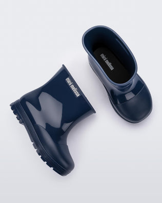 Top and side view of a pair of blue baby Melissa Welly boots.