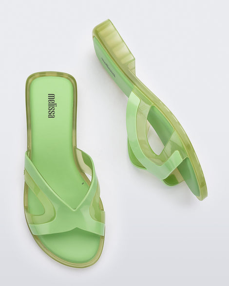 Top and side view of a pair of green Melissa Yacht slides.