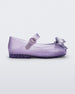 Side view of a lilac Mini Melissa Sweet Love baby mary jane flat with a metallic lilac bow.