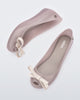 Side and top view of a pair of beige Ultragirl Bow flats.