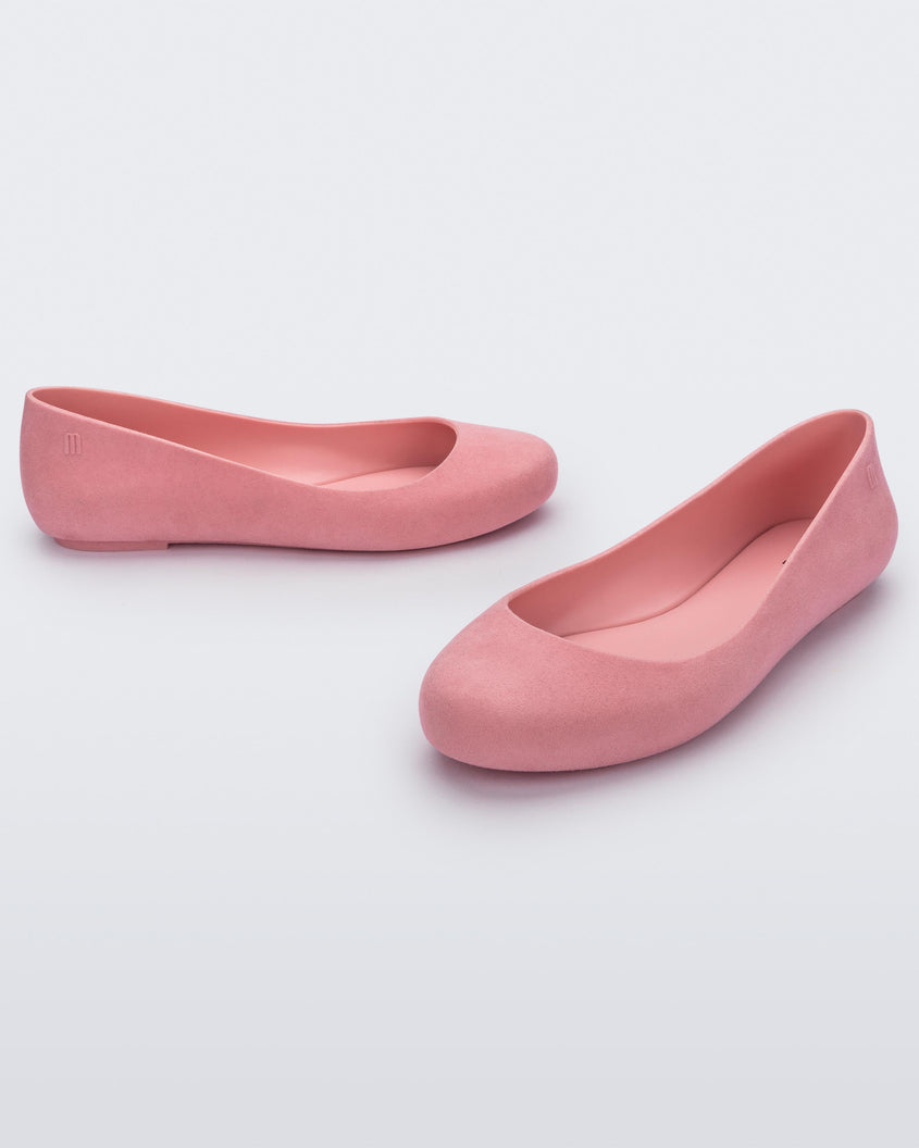 Angled view of a pair of pink flocked Melissa Sweet Love Basic Velvet flats.