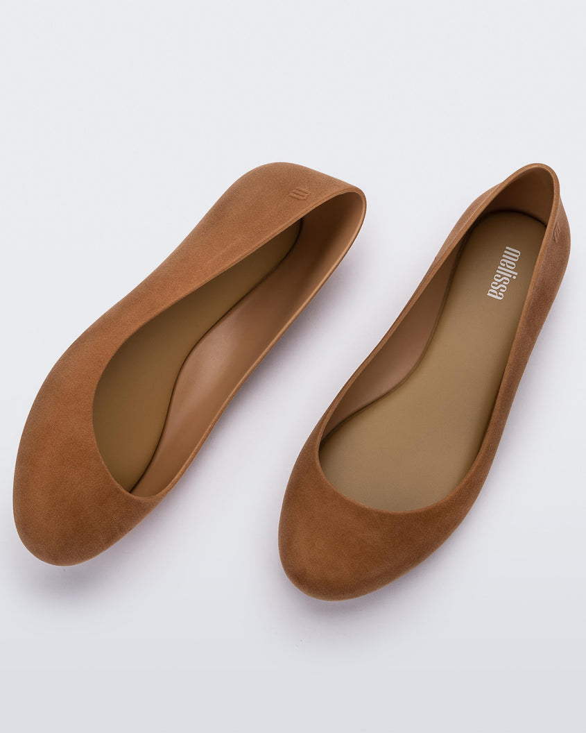 Side and top view of a pair of beige flocked Melissa Sweet Love Basic Velvet flats.