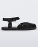 Side view of a black Melissa Papel Espadrille Campana sandal with braided sole detail and ankle strap