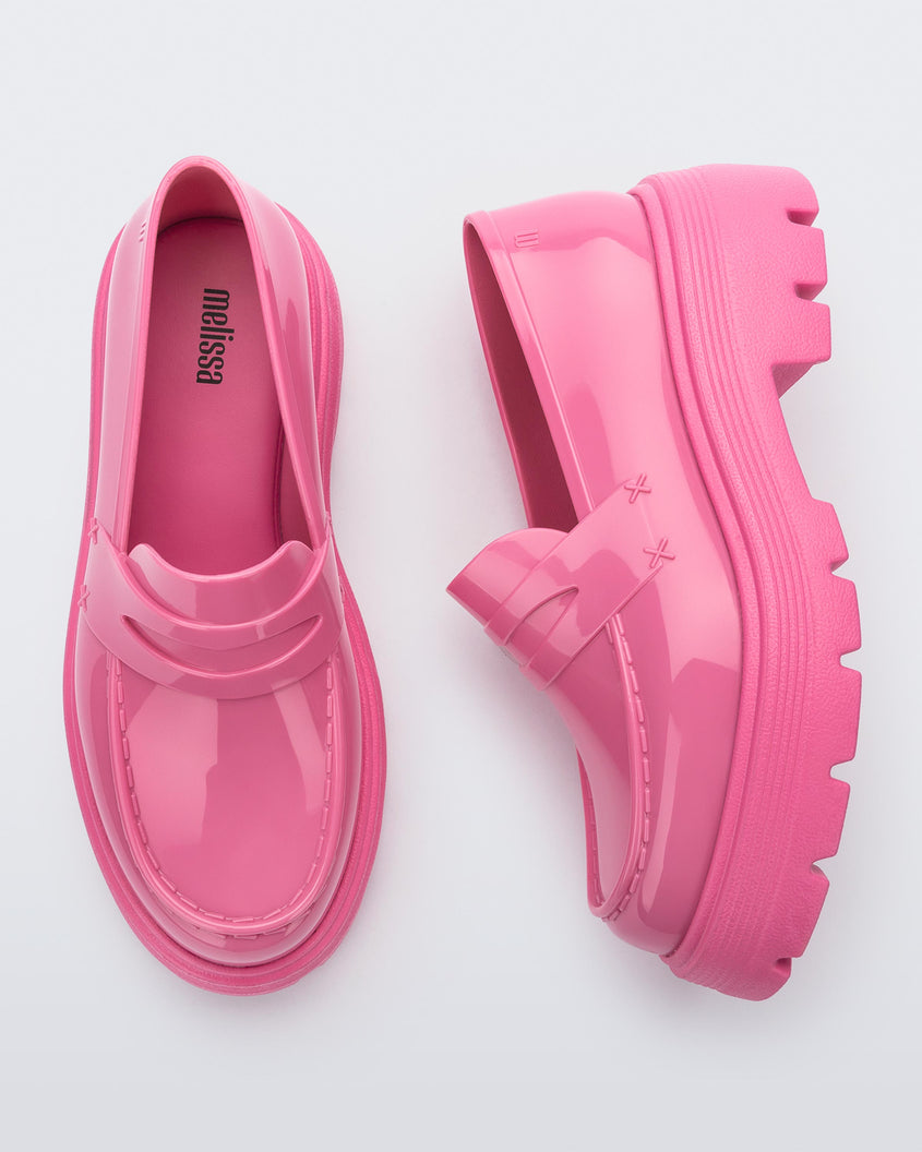 Top and side view of a pair of Melissa Royal platform loafers in Pink