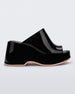 Side view of a Black Melissa Patty platform mule with beige outsole.