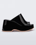 Side view of a Black Melissa Patty platform mule with beige outsole.