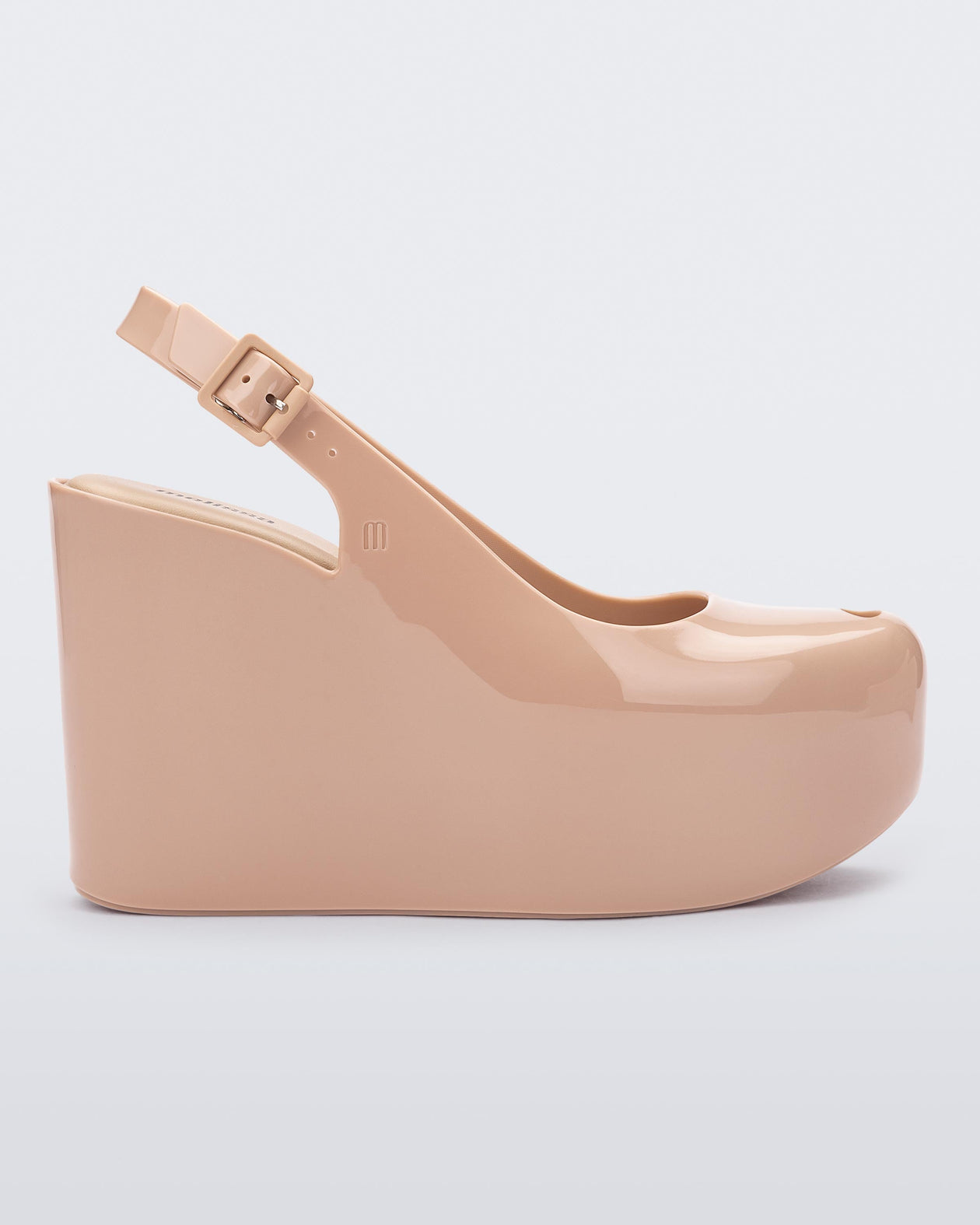 Side view of a beige Melissa Groovy wedge platform slingback heel with peep toe. 