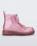 Side view of a glitter pink kids Melissa Coturno boot.