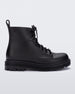 Side view of a black kids Melissa Coturno boot.