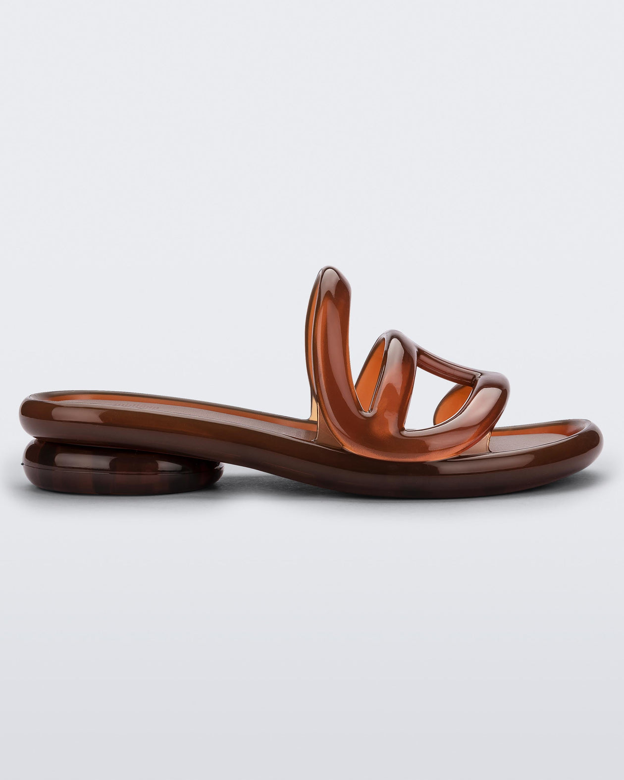 Side view of a Melissa Jelly Slides + Telfar in brown.