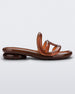 Side view of a Melissa Jelly Slides + Telfar in brown.