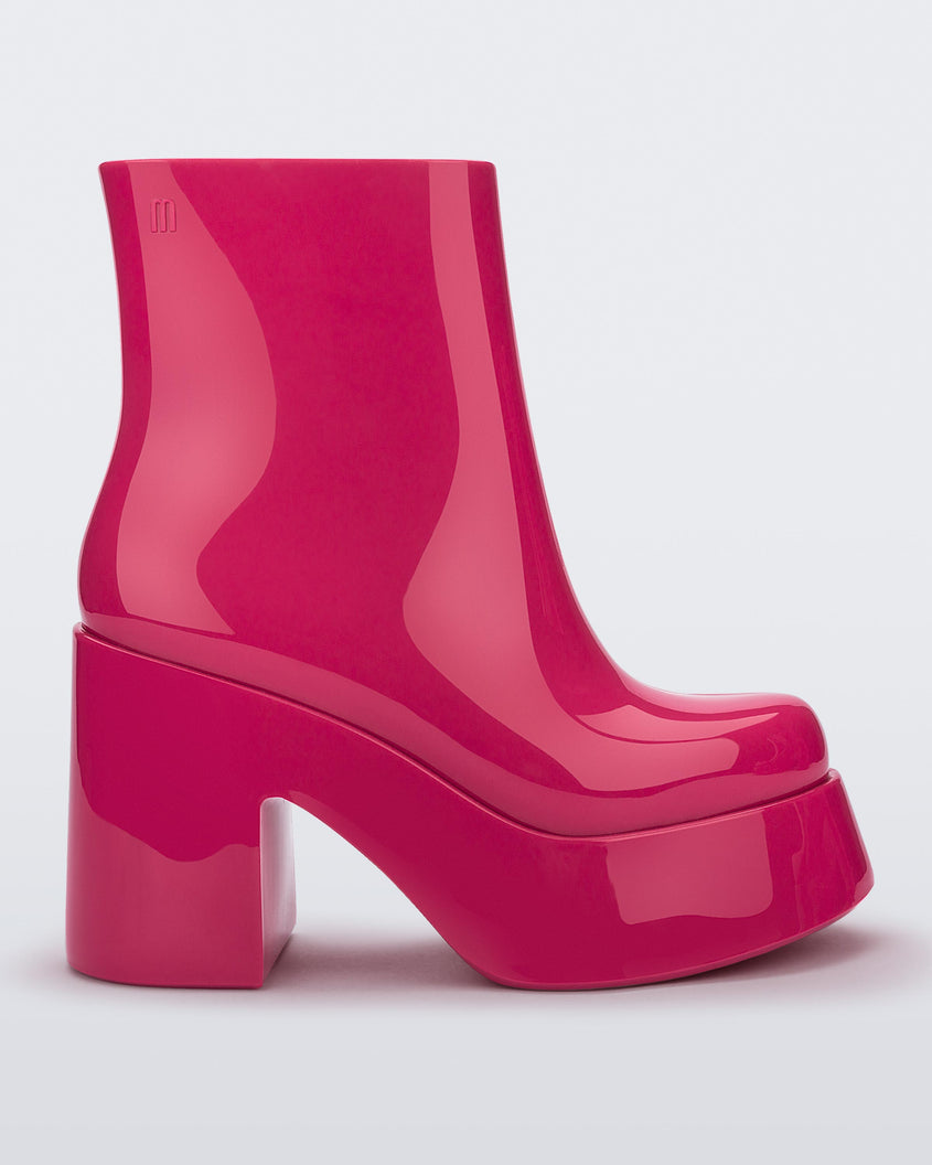Side view of the pink Melissa Nubia platform heel boot.